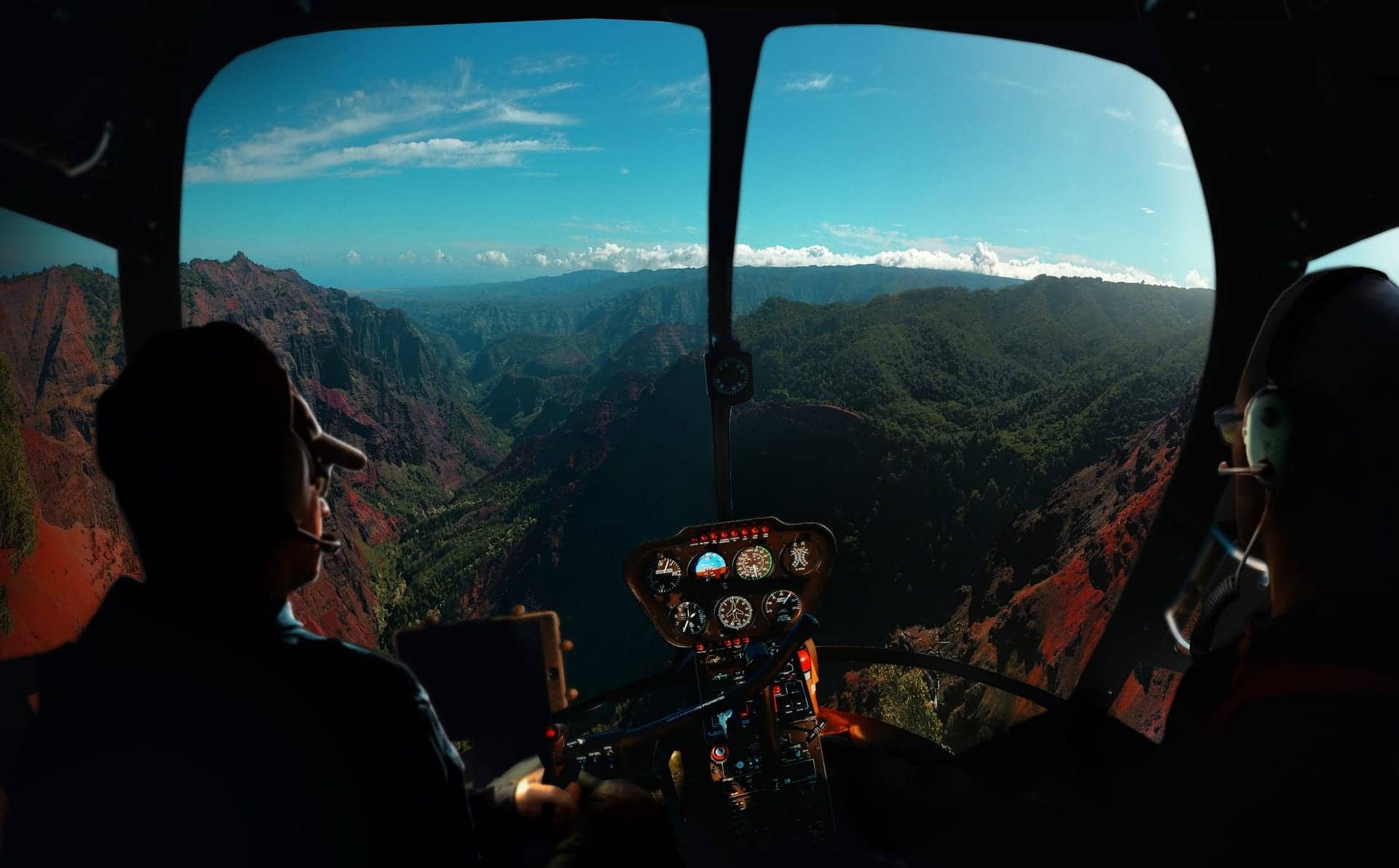 helicopter pilots flying about mountains