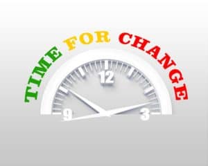 Top half of clock with words, "Time for Change" around it.