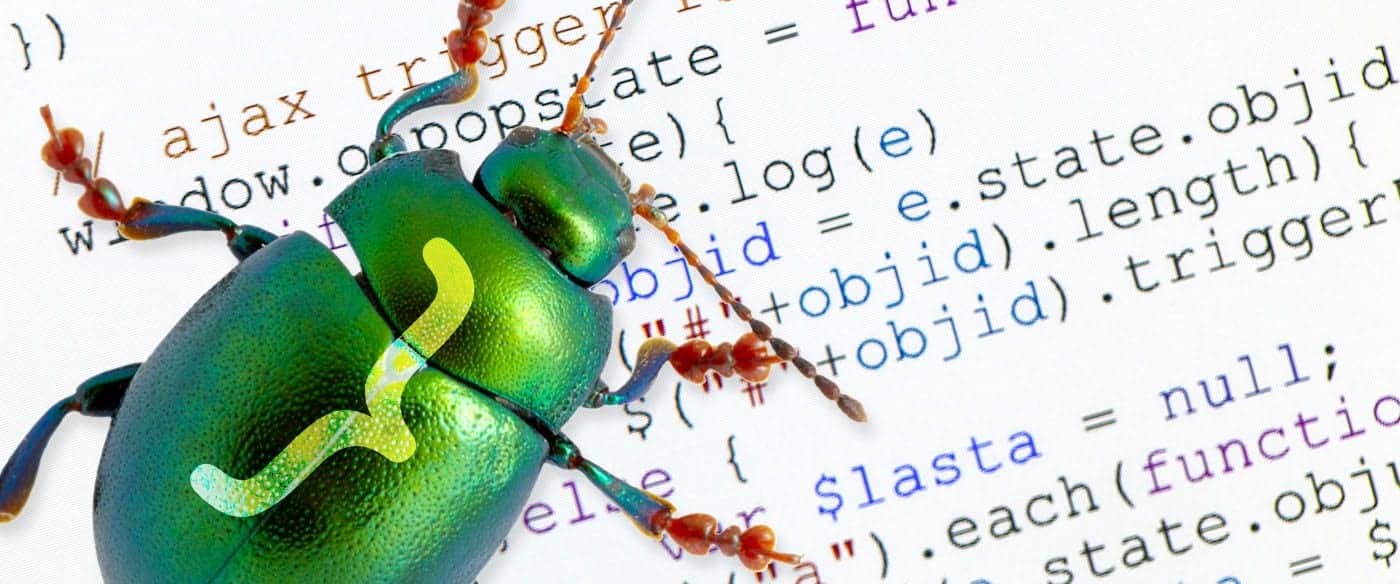 green beetle on top of a code sheet