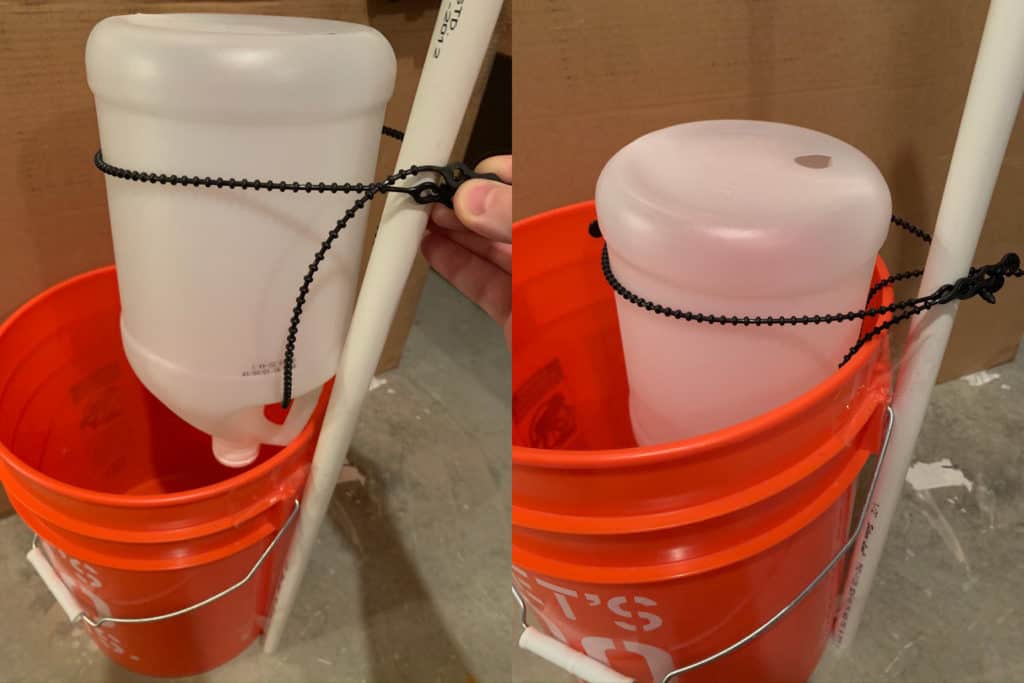 five gallon orange bucket with inverted translucent jug attached to white tube taped onto the bucket