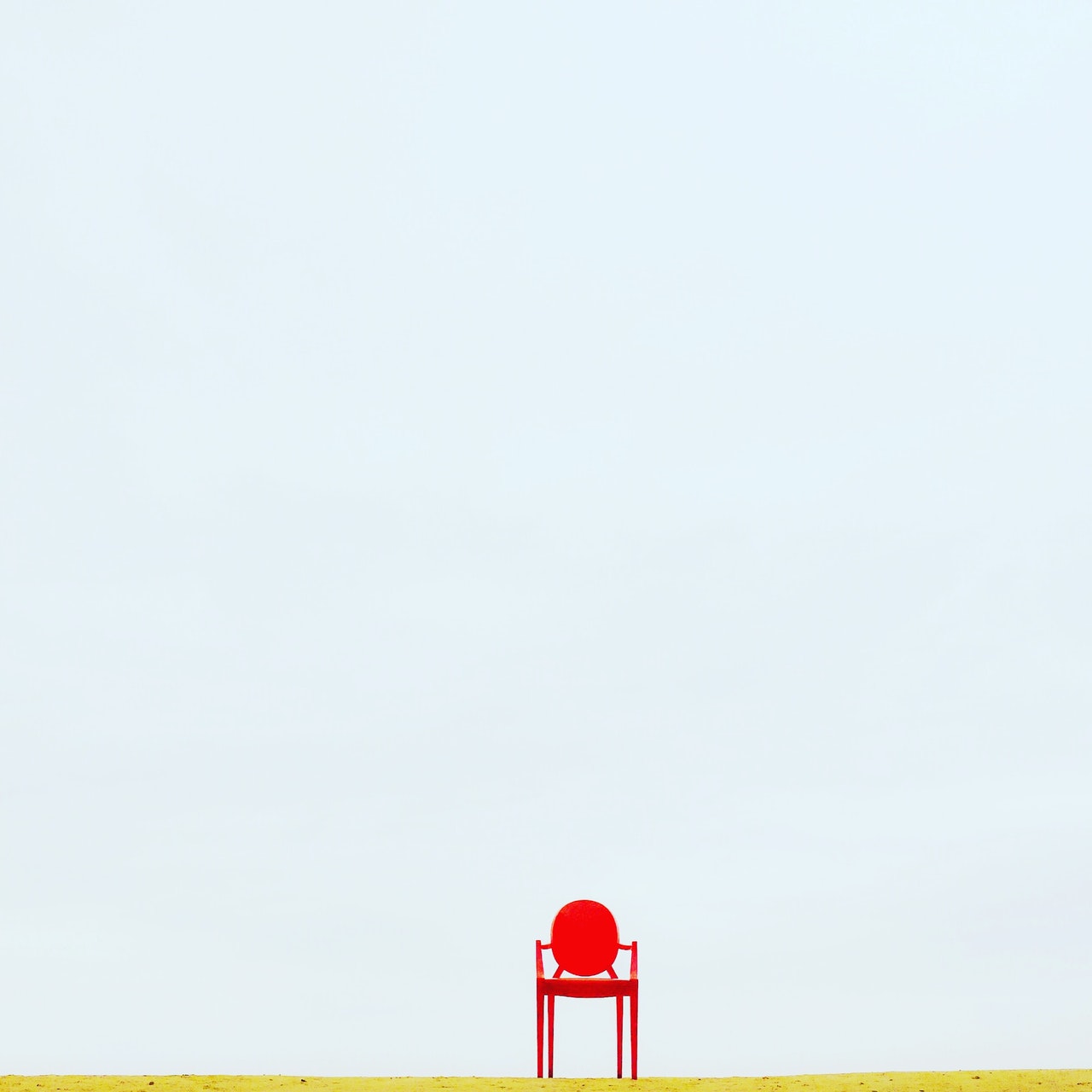 Red Armchair on Brown Surface